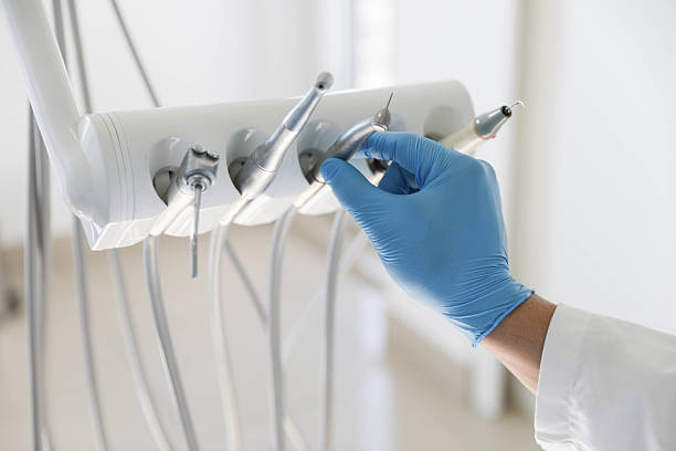 Professional Tooth Extraction technician working in Guilford County County, NC